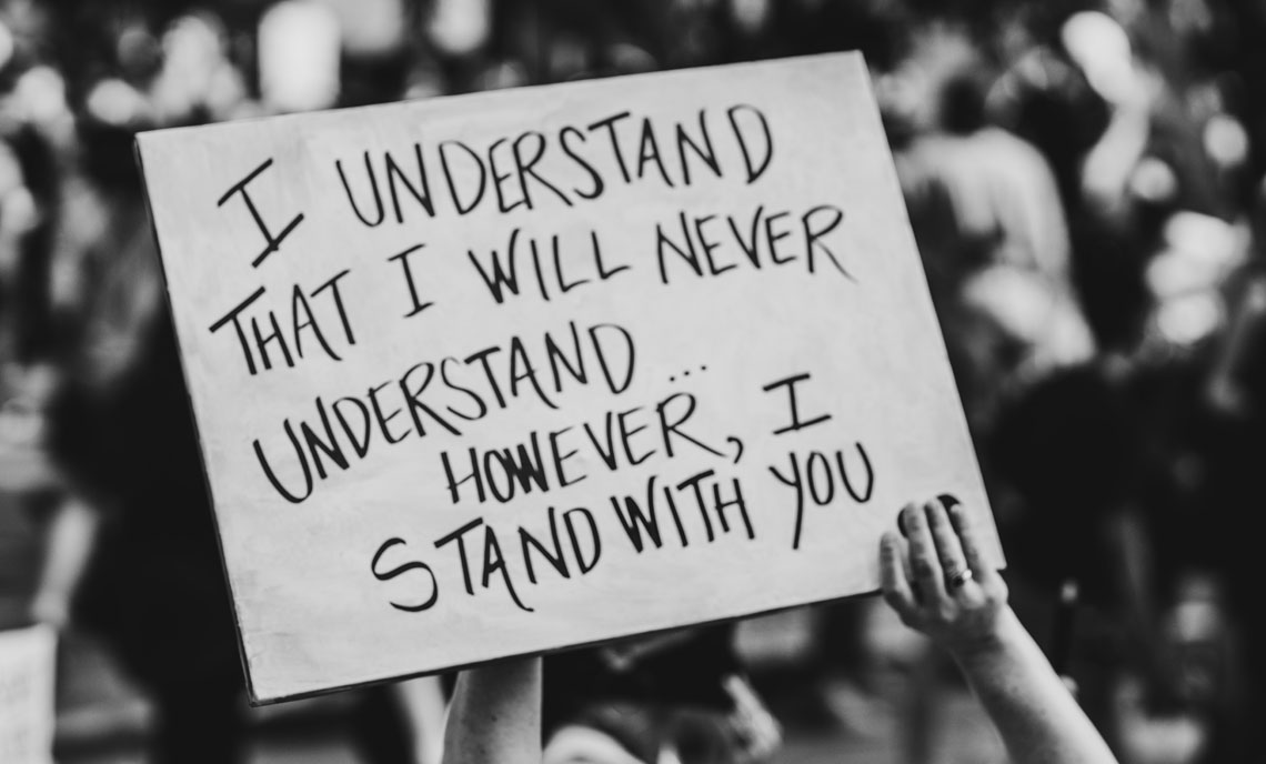 Sign with 'I
                      understand that I will never understand... However, I
                      stand with you' written on it.